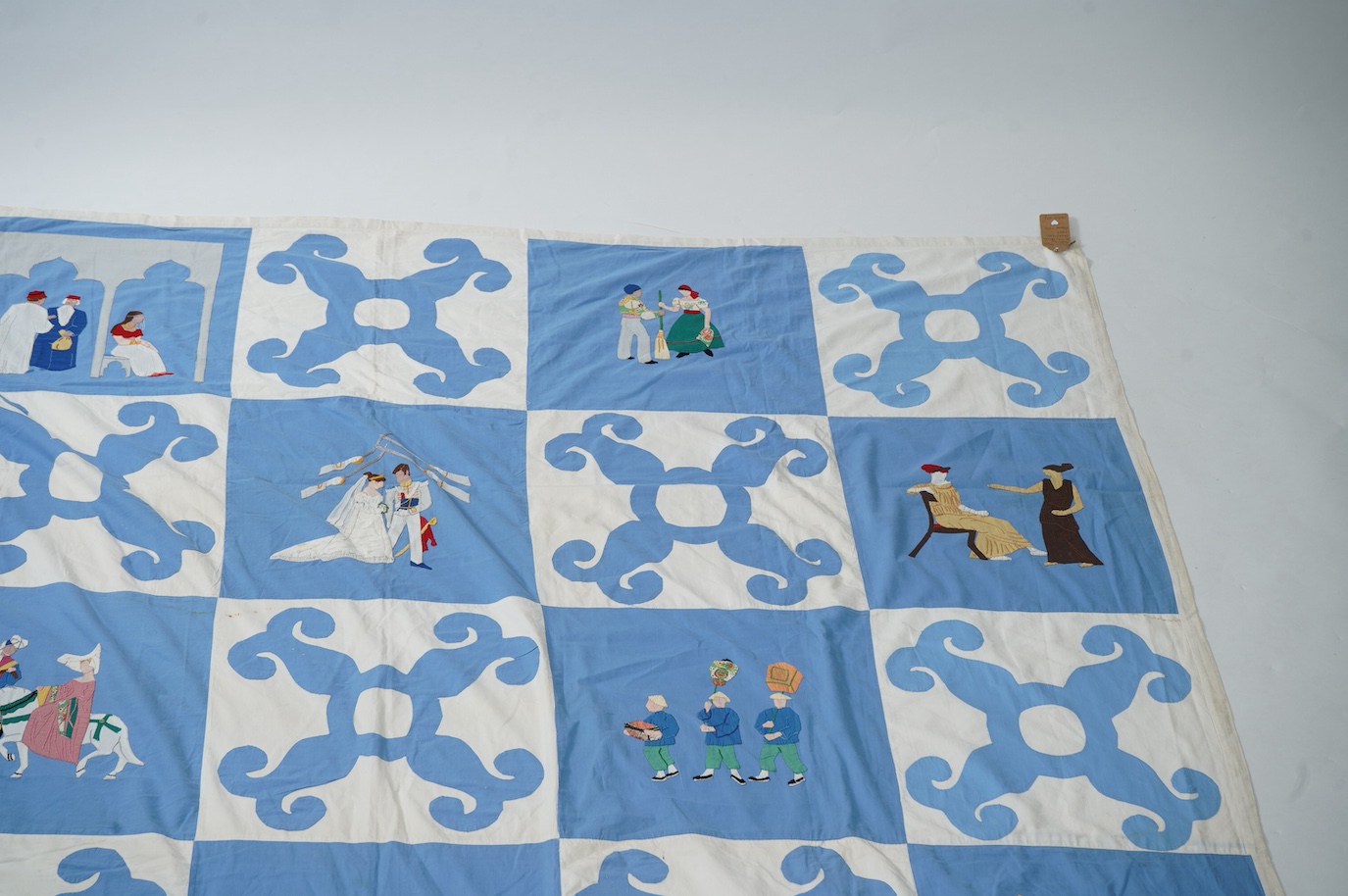 A rare figurative American ‘bridal quilt coverlet’, designed by Marion Cheever Whiteside Newton, whose designs were originally widely published in magazines and sold during the 1940’s-50’s. Her ‘quilting kits’ were also